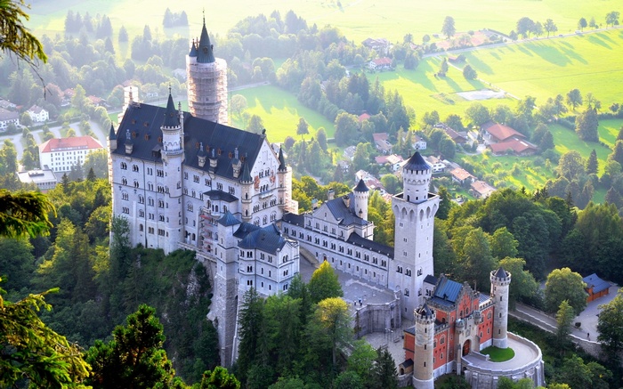 Neuschwanstein Castle in a green landscape