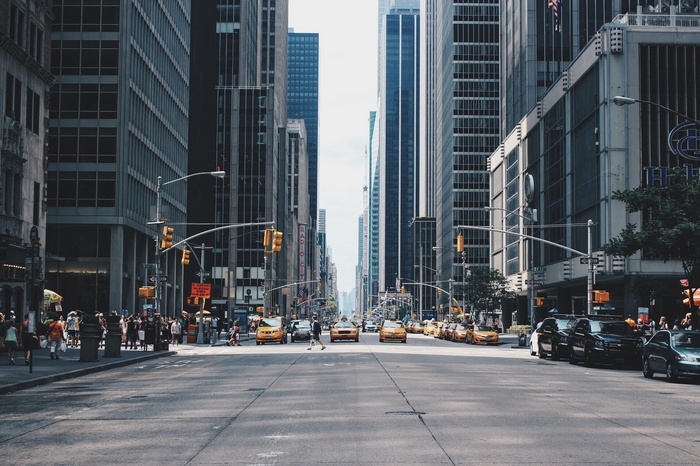 New York City street with yellow taxis and tall buildings
