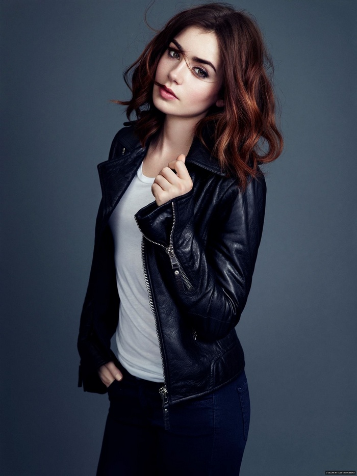 Lily Collins wearing a black leather jacket
