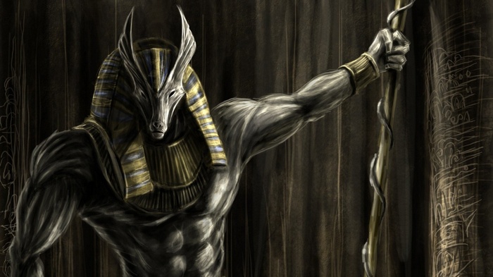 Anubis, the Egyptian god, holding a staff
