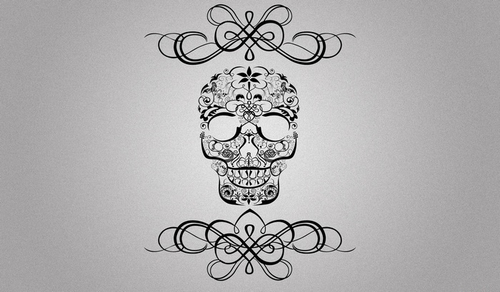 Ornate black skull with decorative flourishes