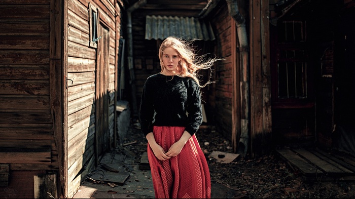 Woman with blonde hair in a red skirt