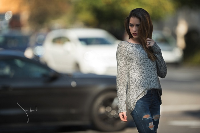 Woman in Grey Sweater and Torn Jeans by Juan Renart