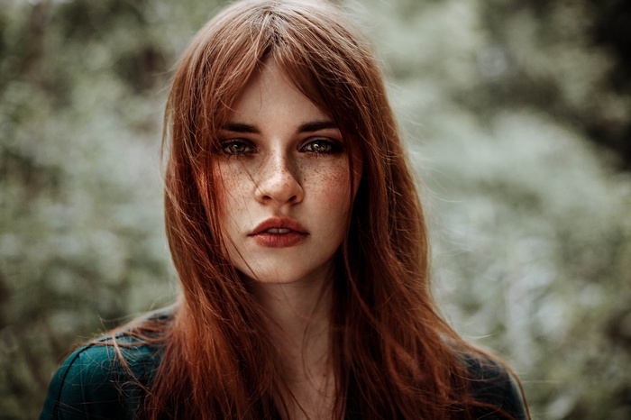 Redhead woman with freckles in a portrait