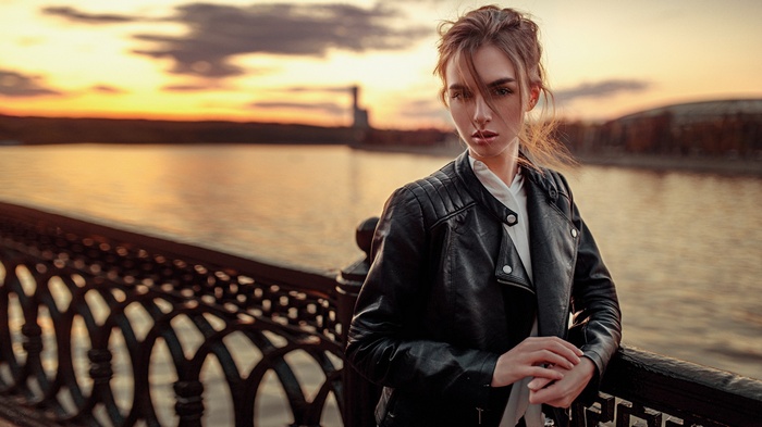 Viktoria Vishnevetskaya in a leather jacket by the river