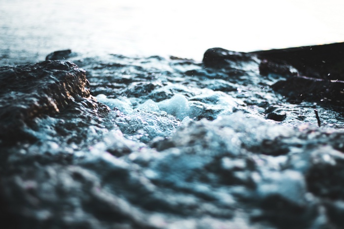 Waves crashing on rocks near the sea