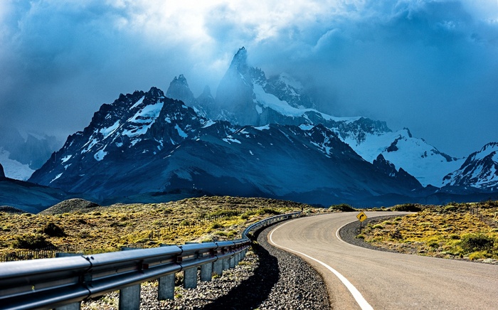 Winding road leading to snowy peaks in Patagonia, Argentina