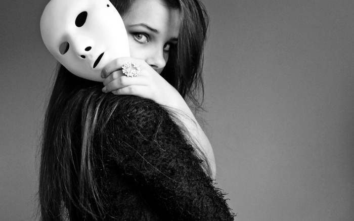 Woman holding a white mask