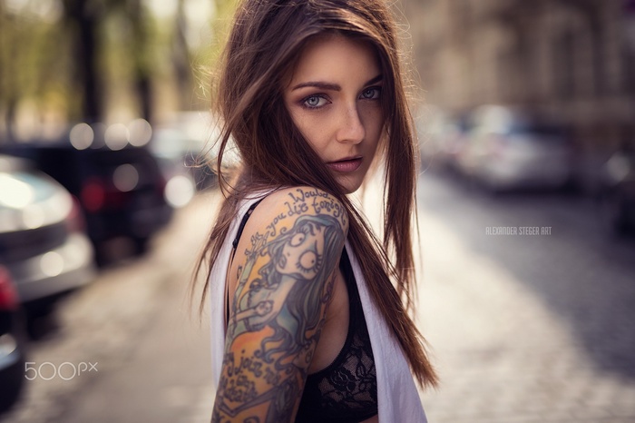 Woman with tattoos and black bra on 500px