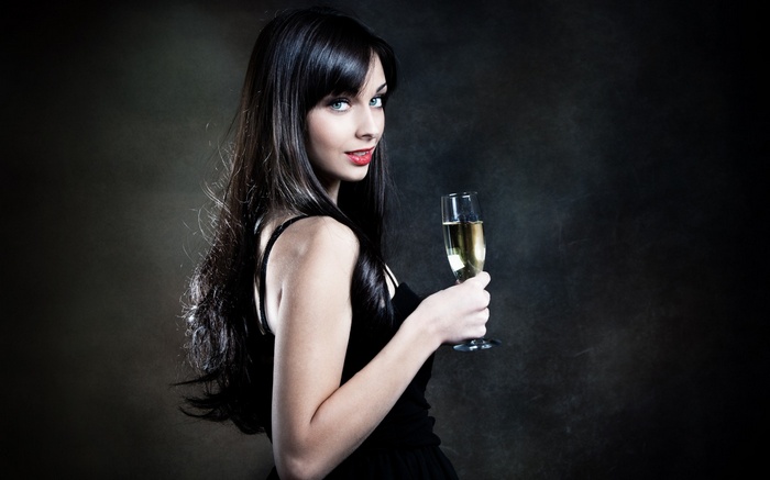 Woman holding a glass of champagne