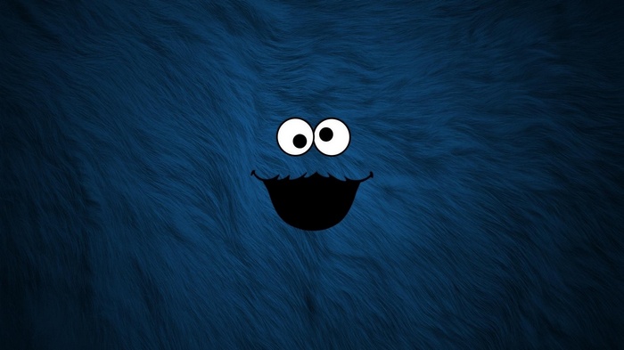 Cookie Monster face on blue furry background