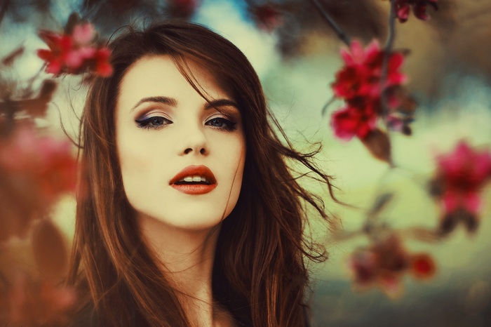 Woman with red lipstick and makeup outdoors
