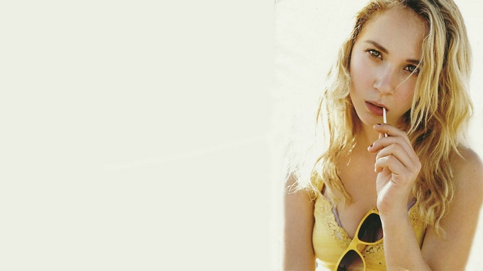 Juno Temple with a lollipop and sunglasses