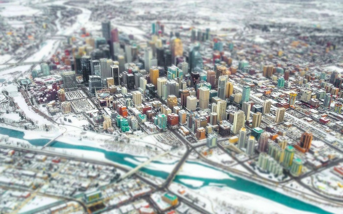 Calgary cityscape in winter with a river and snow