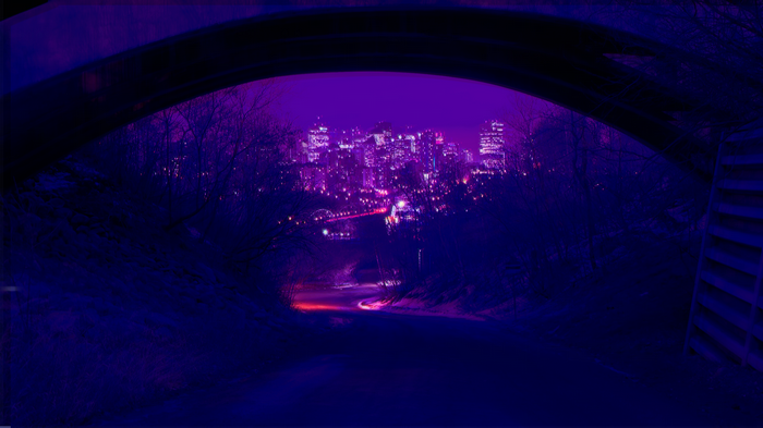 Neon Cityscape viewed from under a bridge