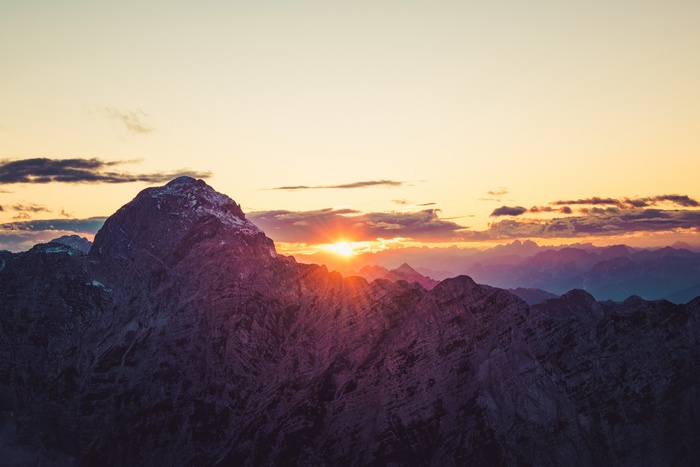 Mountains at sunset with sun rays