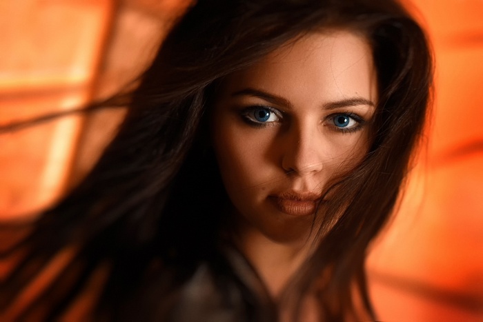 Portrait of a woman with blue eyes and dark hair