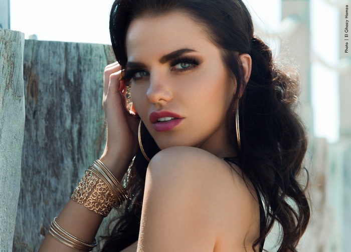 Woman with dark hair and makeup