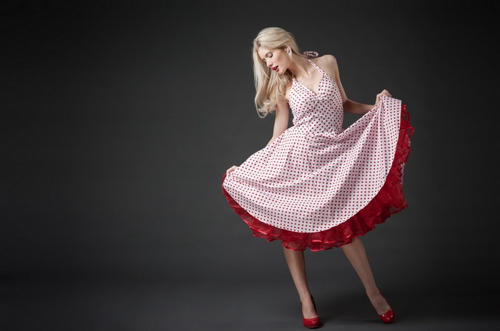 Woman in a polka dot dress posing