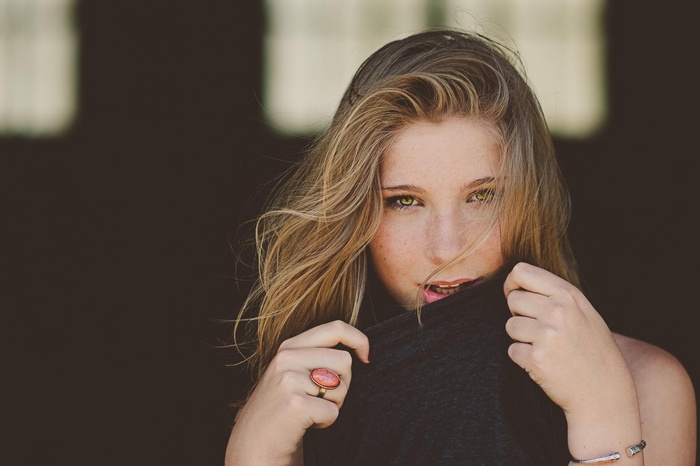 Woman with blonde hair and green eyes
