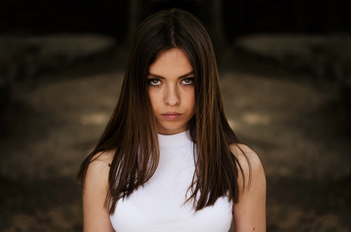 Portrait of a young woman with long brown hair
