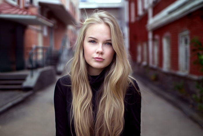 Young blonde woman in a black turtleneck