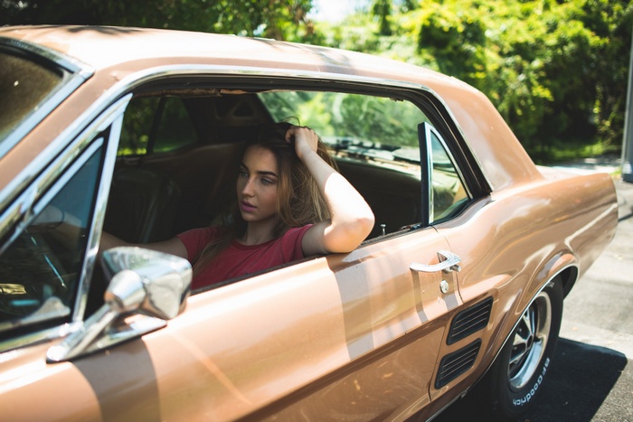 Woman in a Ford Mustang