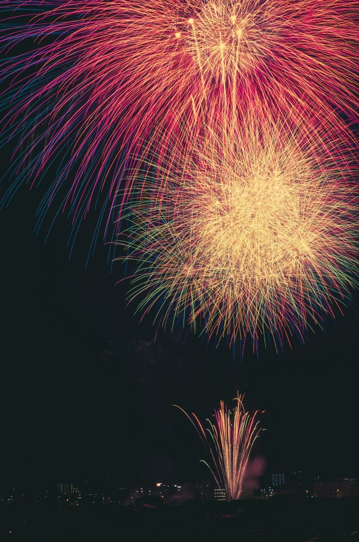 Fireworks display over a city at night