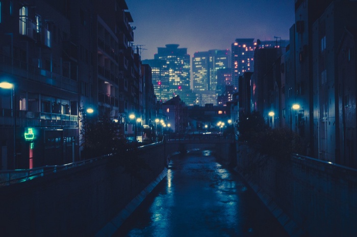 Cityscape at night with a canal in Japan