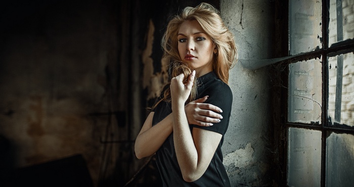 Carla Sonre posing by a window