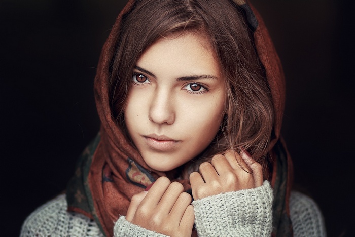 Woman wearing a headscarf and sweater
