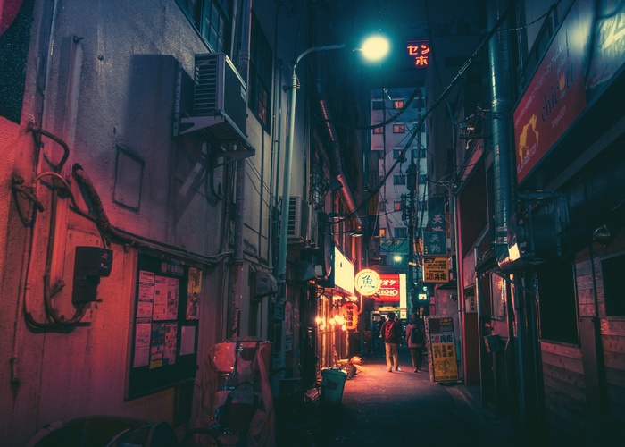 Night alley in Japan with neon signs