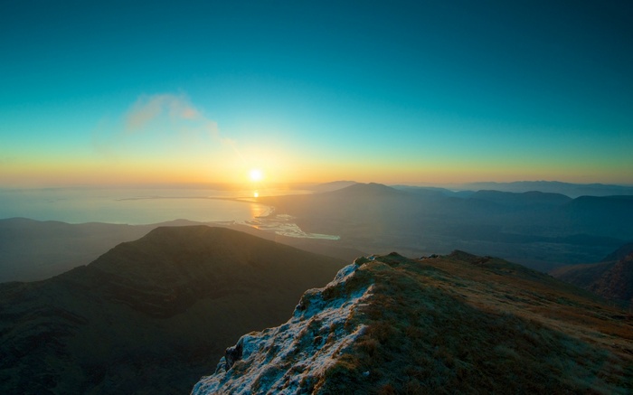 Sunrise over mountains and sea