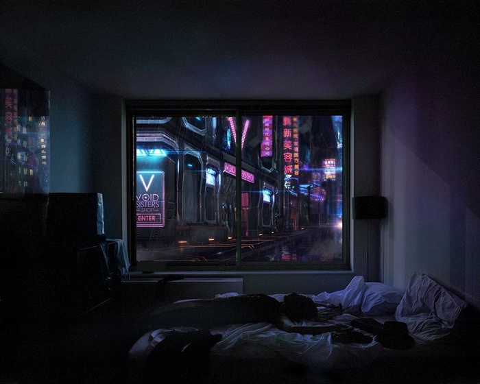 Person sleeping in a room overlooking a neon city at night