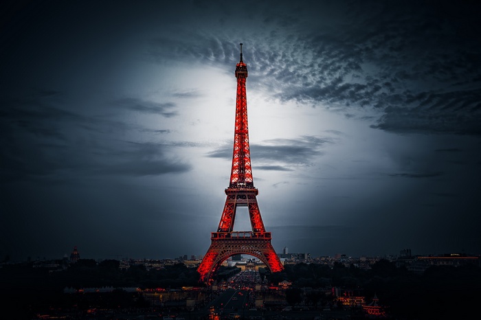 Eiffel Tower illuminated in red at night