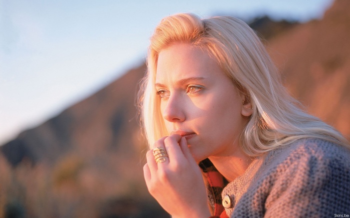 Scarlett Johansson wearing a ring and looking into the distance