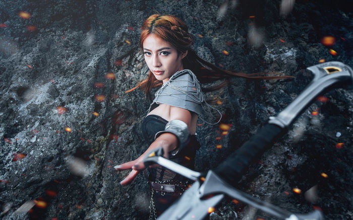 Asian woman in cosplay with a sword