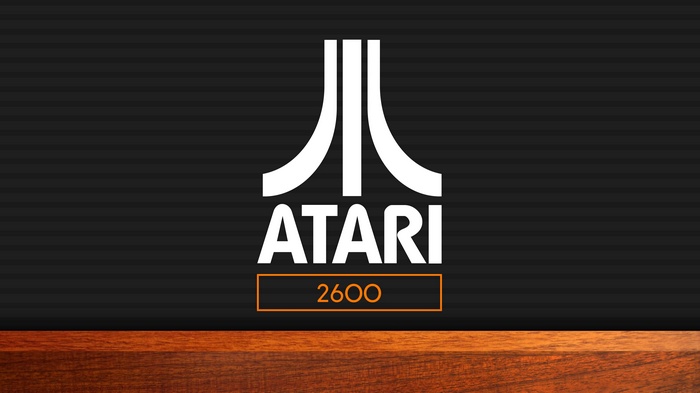 Atari 2600 logo on a dark background with wood texture
