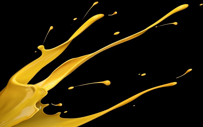 Yellow paint splash on black background