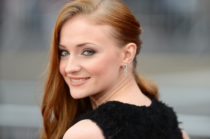 Sophie Turner with green eyes and red hair