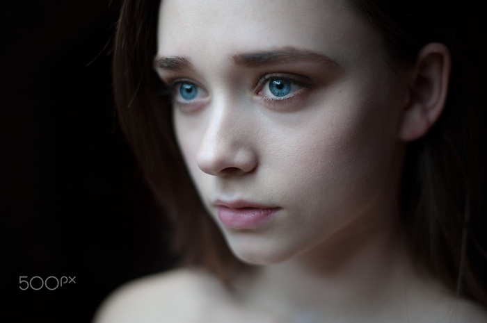 Portrait of a young woman with blue eyes