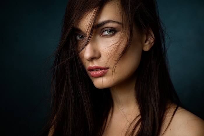 Portrait of a woman with brunette hair and green eyes