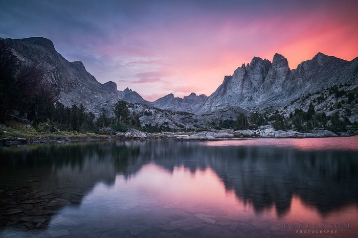 Mountain lake at sunset with colorful sky