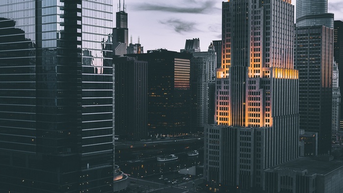 Chicago skyscrapers at dusk with a river