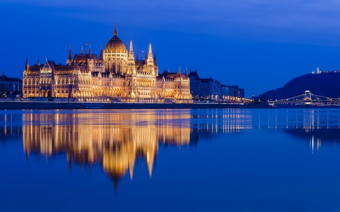 Hungarian Parliament Building reflected in the Danube River at night