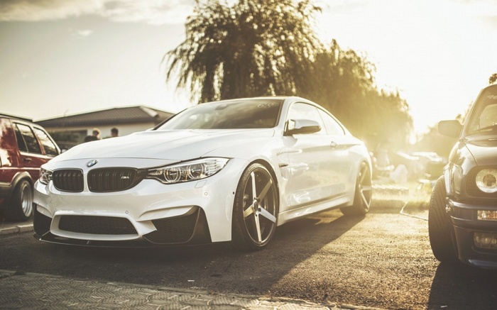 White BMW M4 coupe in sunlight