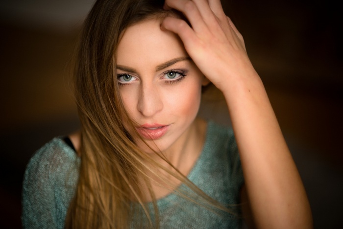 Woman with long blonde hair and green eyes