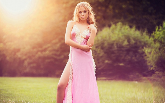 Paulina Johnson in a pink dress outdoors