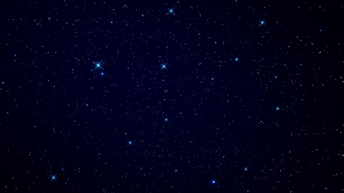 A dark night sky filled with twinkling stars
