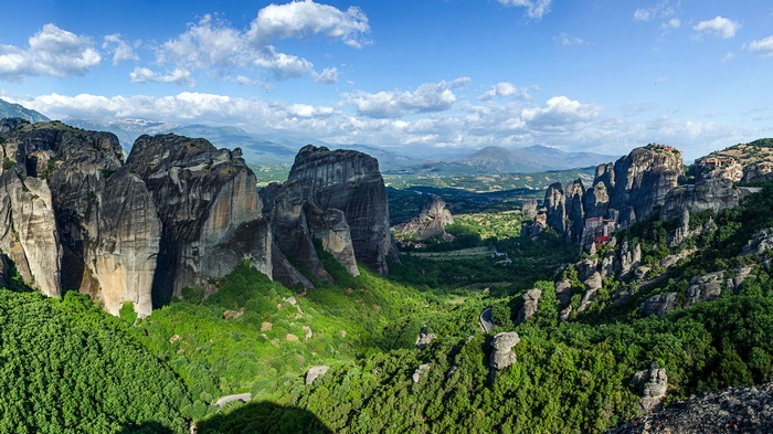 Meteora rock formations with monasteries and green forest
